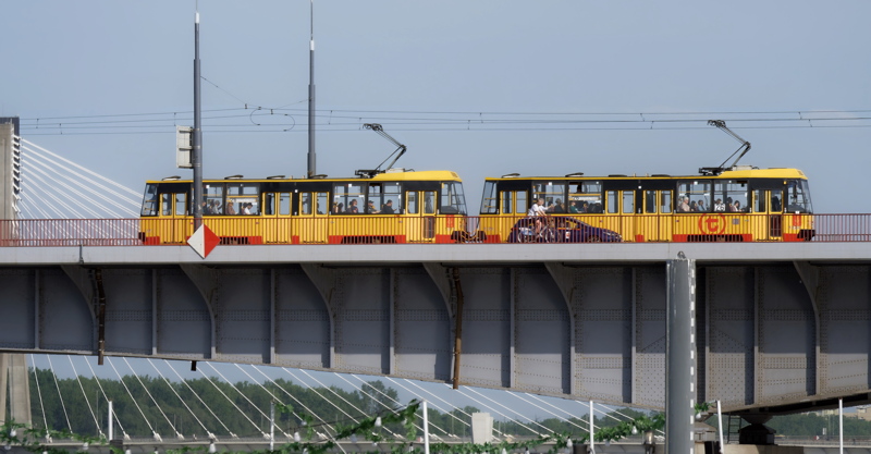 Yellow and red Konstal 105Na tram